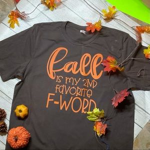 Bella tee, size small, brown & orange writing.